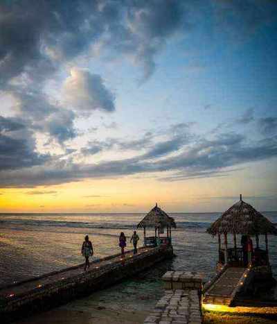 Sunset over the ocean cabana dock at Christopher's at Hermosa Cove