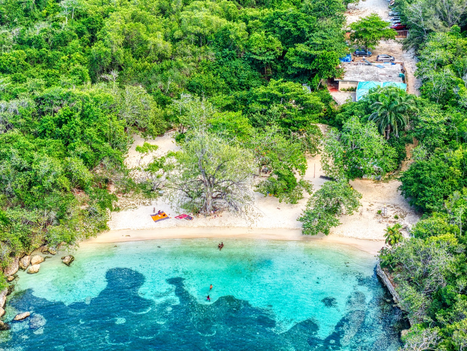 Aerial view of Columbus Cove Beach, turquoise water and white sand