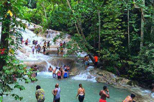 Dunn's River Falls Jamaica - people climbing the cascading waterfall