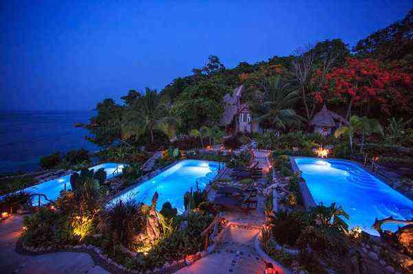 Christopher's at Hermosa Cove Jamaica - stunning illuminated pools at night ocean view tropical gardens