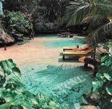 Mahogany Beach Ocho Rios Jamaica - secluded turquoise cove with sun loungers tropical palms