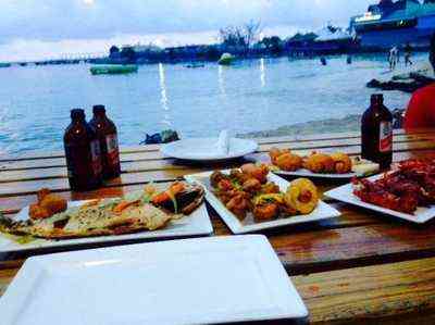 Lobster Dave Ocho Rios Jamaica - fresh seafood spread grilled fish lobster Red Stripe beer ocean view