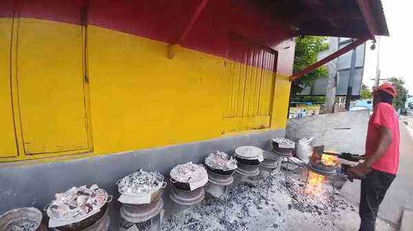 The Pudding Man Priory Jamaica - traditional pudding baked over coal fire roadside