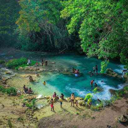 Mada Fed Nature River Jamaica - aerial view turquoise natural swimming pool local people swimming